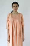 Merakus_Peach Cotton Plain Round Neck Pleated Yoke Dress  _Online_at_Aza_Fashions