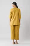 Shop Naintara Bajaj Yellow Cotton Open Neck Solid Top And Pleated Hem Pant Co-ord Set at Aza Fashions Shop_Naintara Bajaj_Yellow Cotton Open Neck Solid Top And Pleated Hem Pant Co-ord Set _at_Aza_Fashions