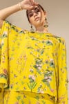 Sakshi Girri_Yellow Crepe Printed Botanical Round Cape And Bell Bottom Pant Set _Online_at_Aza_Fashions