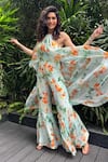 Mandira Wirk_Green Chiffon Printed Floral Halter Draped Jumpsuit_at_Aza_Fashions