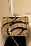Shop_Adwita Bags & Jewels_Gold Mother Of Pearl Aaroohi Leaf Carved Clutch _at_Aza_Fashions