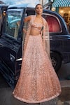 Buy_Seema Gujral_Peach Net Embroidered Sequins Sweetheart Bridal Lehenga Set _at_Aza_Fashions