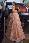 Seema Gujral_Peach Net Embroidered Sequins Sweetheart Bridal Lehenga Set _Online_at_Aza_Fashions