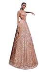 Seema Gujral_Peach Net Embroidered Sequins Sweetheart Bridal Lehenga Set _at_Aza_Fashions