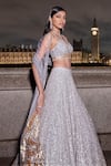 Seema Gujral_Silver Net Embroidered Sequins Plunged V Ombre Lehenga Set _at_Aza_Fashions