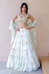 Buy_Foram Patel_White Georgette Printed Paisley Round Tiered Lehenga Set _at_Aza_Fashions