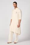 Shop_S&N by Shantnu Nikhil_Off White Brushed Suiting Crest Embroidered Asymmetric Kurta_Online_at_Aza_Fashions