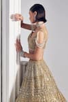 Ruchika Hurria_Gold Net Embroidered Sequin Plunge Leaf Lehenga Blouse Set _Online_at_Aza_Fashions