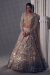 Buy_Ruchika Hurria_Ivory Net Embroidered Sequin Plunge V Tassel Detailed Lehenga Set _at_Aza_Fashions