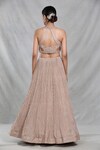 Shop_Samyukta Singhania_Beige Silk Embroidery Sequin Halter Neck Peony Bloom Lehenga Set_at_Aza_Fashions