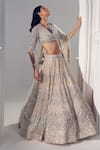 Buy_Ruchika Hurria_Ivory Net Embroidered Sequin V Neck Bridal Lehenga Set _at_Aza_Fashions