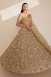 Shop_Ruchika Hurria_Ivory Net Embroidered Pearl Plunge Bridal Lehenga With Blouse Set_at_Aza_Fashions