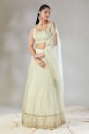 Astha Narang_Off White Net Embroidered Floral U Neck Jaal Lehenga Set_at_Aza_Fashions