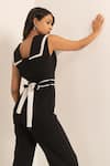 Kritika Madan Label_Black Crepe Plain Double Collared Jumpsuit With Belt _at_Aza_Fashions