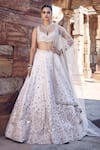 Buy_MATSYA_Ivory Blouse And Lehenga Raw Silk Embroidery Dori Leaf Royal Nandi Bridal Set_at_Aza_Fashions