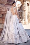 Shop_MATSYA_Ivory Blouse And Lehenga Raw Silk Embroidery Dori Leaf Royal Nandi Bridal Set_at_Aza_Fashions
