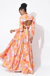 Shop_Rishi and Vibhuti_Orange Crepe Printed Floral Sweetheart Neck Whirl Skirt Embellished Lehenga Set _at_Aza_Fashions