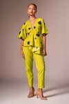 neetiandmudita_Yellow Cotton Polka Dots Tie-up V Neck Asymmetric Peplum Top And Pant Co-ord Set _Online_at_Aza_Fashions