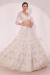 Buy_Sidhaarth & Disha_Ivory Net Embroidery Sequin V Neck Chevron Bridal Lehenga Set _Online_at_Aza_Fashions