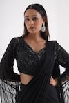 Shop_Chaashni by Maansi and Ketan_Black Net Embroidered Solid Pre-draped Saree With Embellished Cape Sleeve Blouse_Online_at_Aza_Fashions