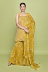 Buy_LABEL SHRISTI CHETANI_Yellow Chiffon Print Floral Square Neck Buttercup Bloom Kurta Sharara Set_at_Aza_Fashions