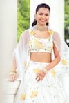 Khushboo Chugh_Ivory Net Embellished Beads Scoop Floral Lehenga Set _at_Aza_Fashions