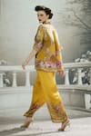 Shop_Rajdeep Ranawat_Yellow Modal Satin Printed Floral Permaz Border Flared Pant_at_Aza_Fashions