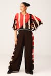 Buy_LABEL SHRISTI CHETANI_Red Crepe Printed Linear Round Neck Cape With Flared Pant_at_Aza_Fashions