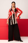 Buy_LABEL SHRISTI CHETANI_Red Crepe Printed Linear V-neck Shirt With Flared Pant_at_Aza_Fashions