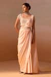 Buy_Nitika Gujral_Peach Net Embroidery Pearl Tassel Embellished Pre-draped Saree With Blouse _at_Aza_Fashions