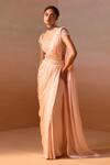 Buy_Nitika Gujral_Peach Net Embroidery Pearl Tassel Embellished Pre-draped Saree With Blouse _Online_at_Aza_Fashions