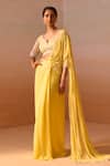 Buy_Nitika Gujral_Yellow Georgette, Net Pearls, Beads Ray Embellished Pre-draped Saree With Blouse _at_Aza_Fashions