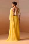 Shop_Nitika Gujral_Yellow Georgette, Net Pearls, Beads Ray Embellished Pre-draped Saree With Blouse _at_Aza_Fashions