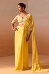 Buy_Nitika Gujral_Yellow Georgette, Net Pearls, Beads Ray Embellished Pre-draped Saree With Blouse _Online_at_Aza_Fashions