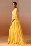 Shop_Nitika Gujral_Yellow Georgette, Net Pearls, Beads Ray Embellished Pre-draped Saree With Blouse _Online_at_Aza_Fashions