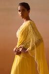 Nitika Gujral_Yellow Georgette, Net Pearls, Beads Ray Embellished Pre-draped Saree With Blouse _at_Aza_Fashions
