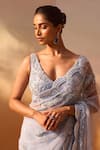 Nitika Gujral_Blue Net Embroidered Crsytal Plunging V Embellished Saree With Blouse_at_Aza_Fashions