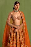 Shop_Neha Khullar_Orange Viscose Raw Silk Embellished Floral Geometric Mughal Printed Lehenga Set_Online_at_Aza_Fashions