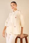 Buy Shivani Bhargava Ivory Cotton Embroidered Thread Mandarin Collar Rose Melody Tunic Top at Aza Fashions Buy_Shivani Bhargava_Ivory Cotton Embroidered Thread Mandarin Collar Rose Melody Tunic Top _at_Aza_Fashions