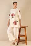 Buy_Shivani Bhargava_Ivory Cotton Embroidered Thread Round Royal Rose Top With Flared Pant _at_Aza_Fashions