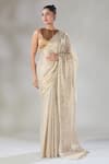 Sheela Suthar_Silver Handwoven Pure Tissue Hima Striped Zari Saree _at_Aza_Fashions