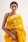 Priyanka Raajiv_Yellow Silk Banarasi Handwoven Chira Pattern Saree With Unstitched Blouse Piece_at_Aza_Fashions