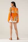 Shop_REENA SHARMA_Orange Viscose Crinkled Chiffon Printed Floral Tie-up Neck Vaani Top_at_Aza_Fashions