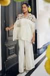 Buy_Label Deepshika Agarwal_White Couture Silk Embroidered 3d Floral V Neck Top And Flared Pant Set _at_Aza_Fashions