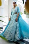 Buy_Label Deepshika Agarwal_Blue Couture Satin Embroidery Iris Fleur V Neck Cape Lehenga Set _at_Aza_Fashions