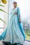 Label Deepshika Agarwal_Blue Couture Satin Embroidery Iris Fleur V Neck Cape Lehenga Set _Online_at_Aza_Fashions