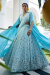 Buy_Label Deepshika Agarwal_Blue Couture Satin Embroidery Iris Fleur V Neck Cape Lehenga Set _Online_at_Aza_Fashions