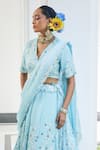 Label Deepshika Agarwal_Blue Couture Satin Embroidery Iris Fleur V Neck Cape Lehenga Set _at_Aza_Fashions