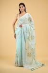 Samyukta Singhania_Blue Linen Blend Hand Painted Floral Tassel Bordered Saree With Running Blouse _Online_at_Aza_Fashions