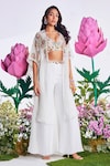 Buy_Nea by Nikita Tiwari_White Raw Silk Hand Embroidered Lotus Plunge-v Cape With Sharara Set_at_Aza_Fashions